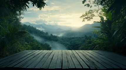 Serene mountain vista viewed from wooden deck, mist-shrouded valley at sunrise.