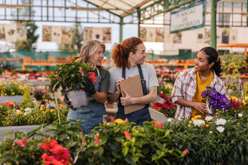 Gardeners collaborating in a plant store