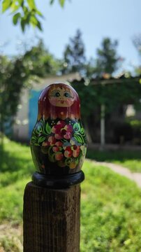 wooden matryoshka doll. Hand Holding a Wooden Matryoshka Doll &ndash; Traditional Russian Nesting Doll. Collection of traditional Russian nesting dolls. Beautiful handmade matryoshka dolls in a row.