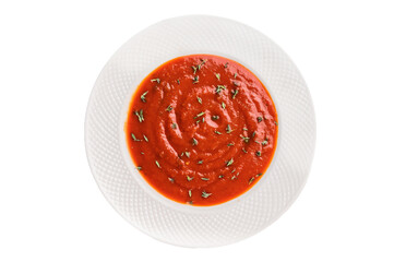 Tomato soup with thyme in plate isolated on white background. top view