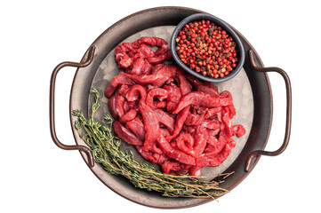 Beef sliced meat, raw veal strips for cooking beef stroganoff on a steel tray isolated on white...
