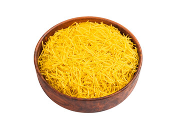 Raw uncooked vermicelli pasta in a bowl isolated on white background. top view