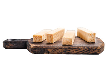 Wafer stick biscuits on wooden board isolated on white background. top view