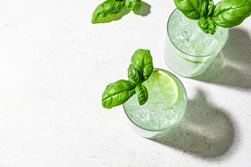 Summer green cocktail drink with lime and basil
