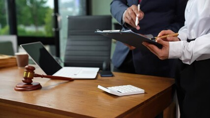 Lawyers and business professionals discuss contract papers at the office. legal and corporate consultation concept focusing on law, advice, and business agreements.