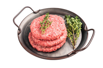Stack of Raw meat patties, cutlets, chopped meat for burgers in stell tray with herbs isolated on...
