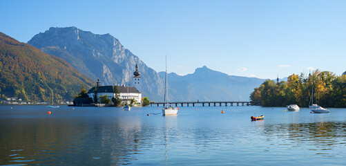 Traunsee Island with Ort Castle and wooden walkway to the mainland. Salzkammergut, Austria,