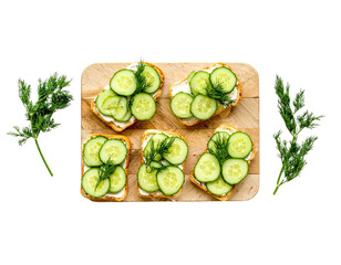 Cucumber Sandwiches with Dill on Wooden Board – Top View

