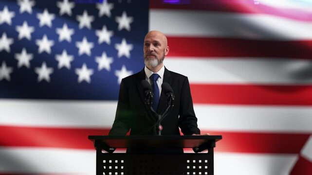 A United States politician gives a euphoric speech with waving U.S. flag on bg