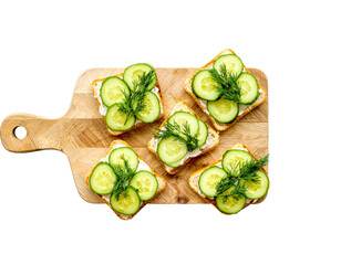 Cucumber Sandwiches with Dill on Wooden Board – Top View

