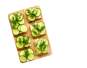 Cucumber Sandwiches with Dill on Wooden Board – Top View

