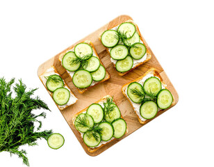 Cucumber Sandwiches with Dill on Wooden Board – Top View

