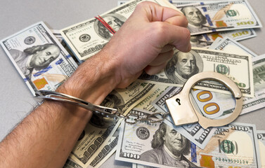 Handcuffed Person Counting Cash - Fraud, Crime, and Financial Investigation Concept