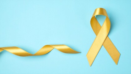Isolated Gold ribbon on Pastel Blue Background with Copyspace 