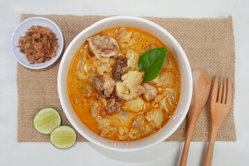 Goat curry is a traditional Indonesian dish made from lamb or goat meat cooked in a spicy, yellowish curry-like sauce called gulai.