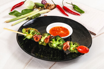 Thai Street foof satay with bacon and broccoli