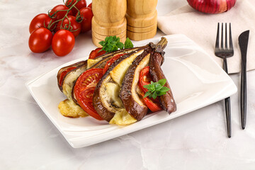 Baked tomato with mozzarella and tomato