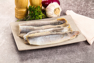 Marinated salted herring fillet apetizer