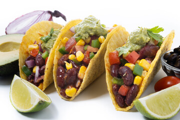 Vegan mexican Taco with beans and guacamole isolated on white background	