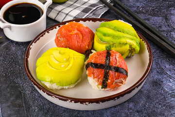 Round tamari sushi with salmon and avocado