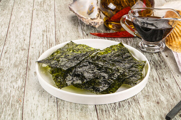 Green nori seaweed chips with soya sauce