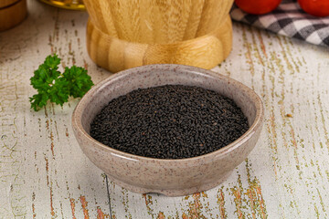 Black dry Nigella seeds in the bowl