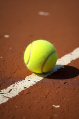 Vibrant Tennis Ball on Clay Court