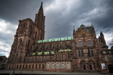The gigantic Strasbourg cathedral looming up into a moody sky
