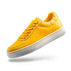 A pair of flying yellow leather women's sneakers, isolated on a clean white background
