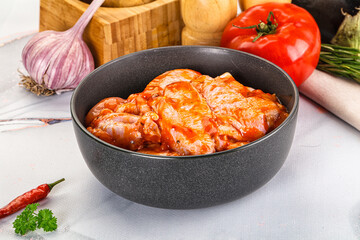 Raw marinated uncooked chicken wings