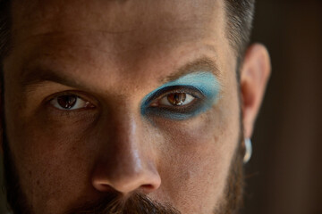 Dopamine split. Man with one side in full Y2K color, the other left bare. Split-makeup contrast....