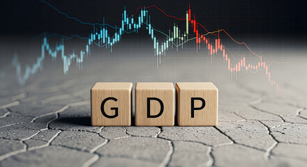 GDP wooden blocks on cracked tiles with fading red declining chart in background, symbolizing economic collapse, financial downturn, or crisis JPG