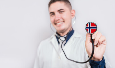 Doctor showing stethoscope with Norway flag. Norway national healthcare concept