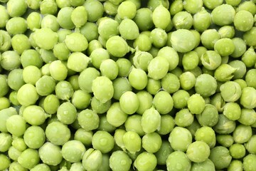 Pile of fresh green peas as background, top view