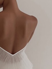 Faceless woman in white towel with soft natural light, neutral wellness aesthetic - 9/16 phone wallpaper background - photography for social media faceless digital content marketing