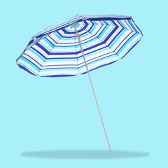 Blue striped beach umbrella casting shadow on light blue background
