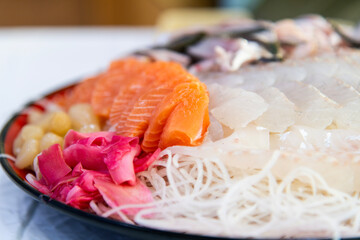 salmon sashimi with ginger and rakkyo