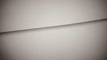 Abstract close-up of a smooth, curved paper surface with soft shadows and subtle texture