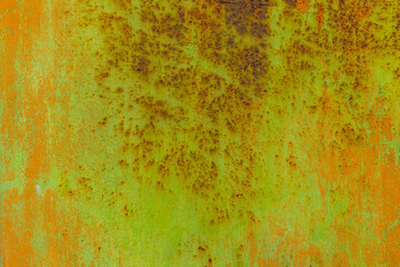 Weathered metal surface with rust and corrosion in industrial setting