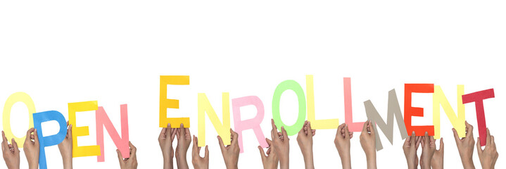 Colorful Open Enrollment Sign Held by Multiple Hands on a White Background