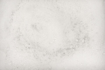 White pure foam in water background texture. dishwashing foam close up