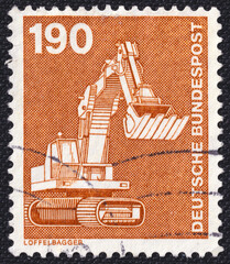 Excavator on a 1982 Germany vintage postage stamp. Industry and Technology Series