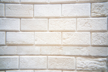 Capturing the timeless beauty of a textured white brick wall in soft light