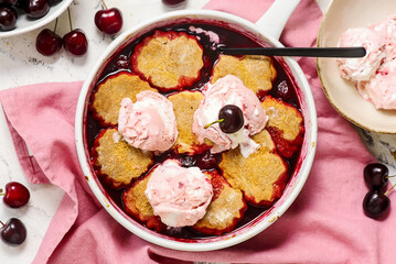 Cherry Cobbler with Honey Butter Vanilla Bean Biscuits in  pan