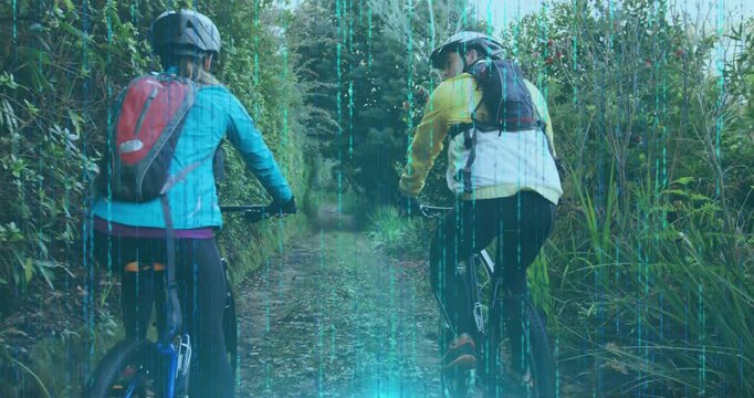 Cyclists pushing pedals and activating sports tech digital data overlay exploring forest trail
