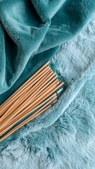 Charming presentation of bamboo sticks piled on a plush background with oceanic hues