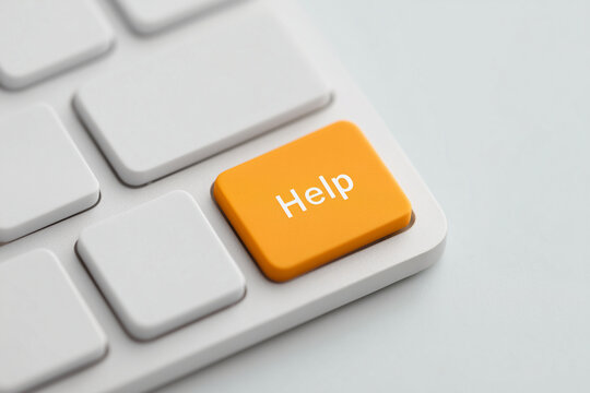 Orange help button on keyboard representing assistance, support, and troubleshooting, symbolic aid for queries, computing guidance, and user comfort