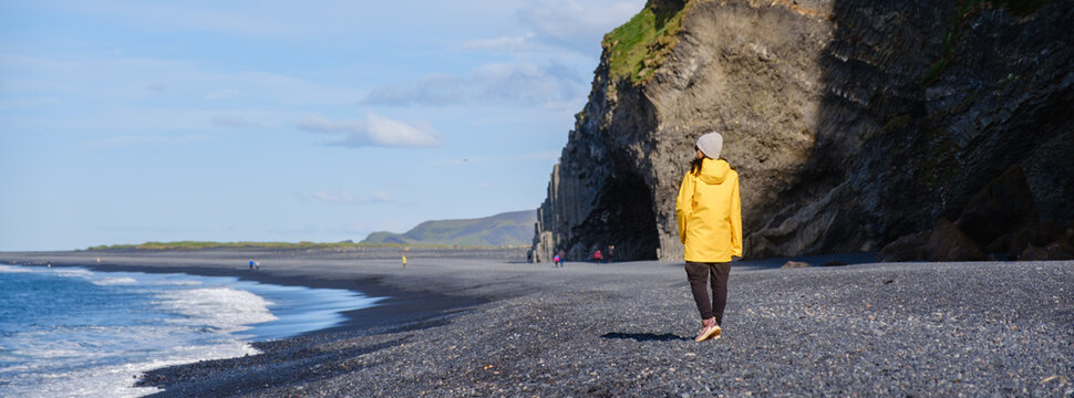 Exploring the breathtaking Reynisfjara Beach in Iceland on a sunny day