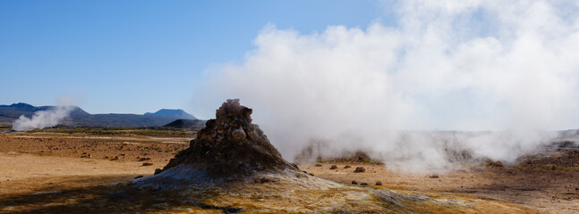 Explore the geothermal wonders of Icelands unique volcanic landscape in stunning daylight