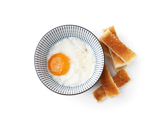 Half-boiled egg in bowl and toasted bread isolated on white, top view. Traditional asian breakfast